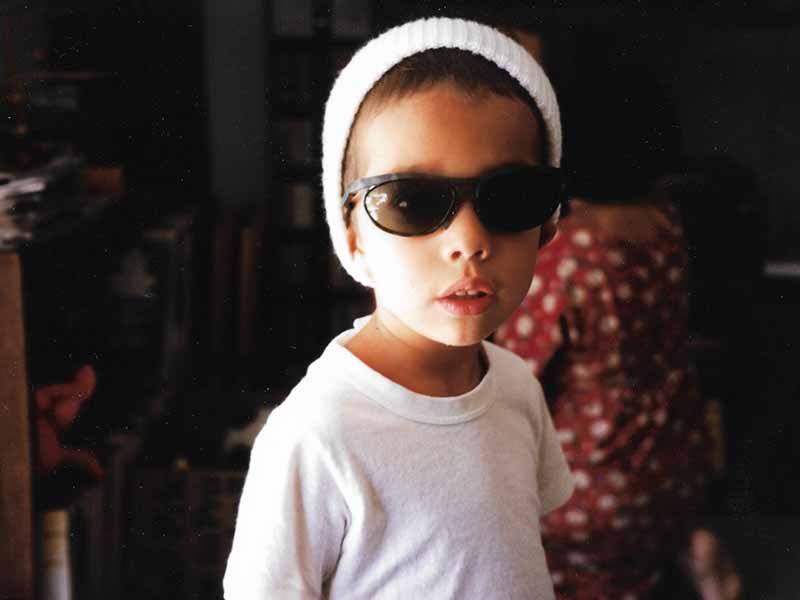 child wearing sunglasses and hat